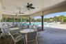 Generous covered space, seating and ceiling fans to keep your family cool at the pool!