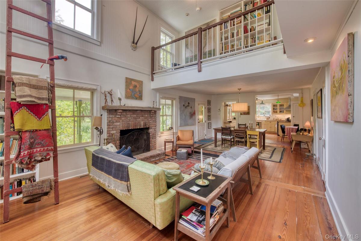 living/ dining/ kitchen with cathedral ceiling and 2nd floor balcony