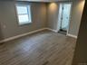 Spare room with wood tiled floors and baseboards