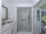 The second full bath doubles as a pool bath and is shared by both the second and third bedrooms