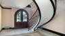 Dramatic curved staircase and entryway