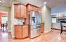 Stainless steel French door refrigerator, wood flooring,  granite counters and crown molding