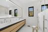 Bathroom featuring double vanity and recessed lighting