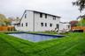 Rear view of property featuring a patio area and an outdoor living space