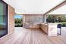 Deck with an outdoor kitchen and a sink