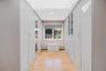 Corridor featuring light wood-style flooring and recessed lighting