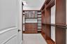 One of two custom closets in the primary suite