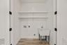 Washroom featuring washer hookup, light wood-style floors, and hookup for a gas dryer