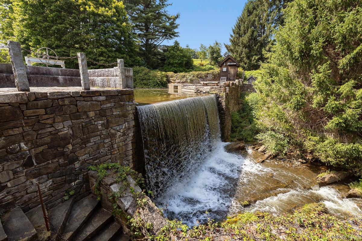 Waterfall next to The Mill House cascading into Rock Cavern