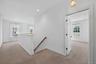 As we head upstairs, we approach a flexible landing area with natural light and easy access to the second floor  bedrooms.