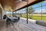 The extended lanai complete with a hot tub and firepit is an entertainers dream, overlooking an expansive fenced yard!