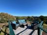 Wooden terrace with an outdoor hangout area