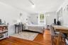 Delightfully bright and cheerful, this upstairs third bedroom is filled with natural light and inviting charm.