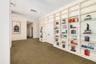 Behind the bookshelves the homeowners used this room as an office, however it could be an additional bedroom and the other door shown open was used as