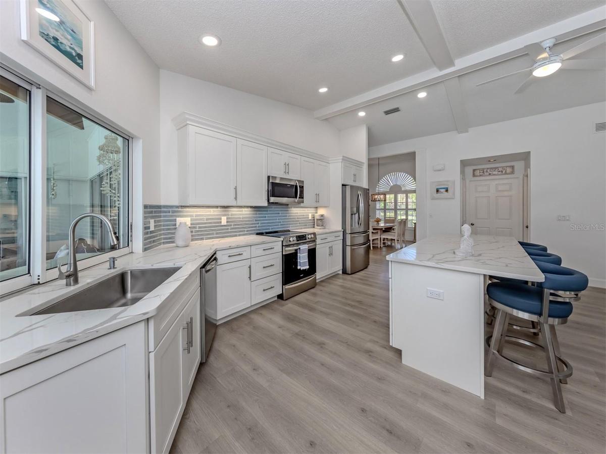 Solid wood cabinetry, soft close drawers, newer appliances makes entertaining in this kitchen a breeze
