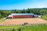 27 12' x 12'stalls, with a 200' x 90' indoor riding ring, and a 220' x 100' outdoor jumping ring with TraveLite dust free footings.