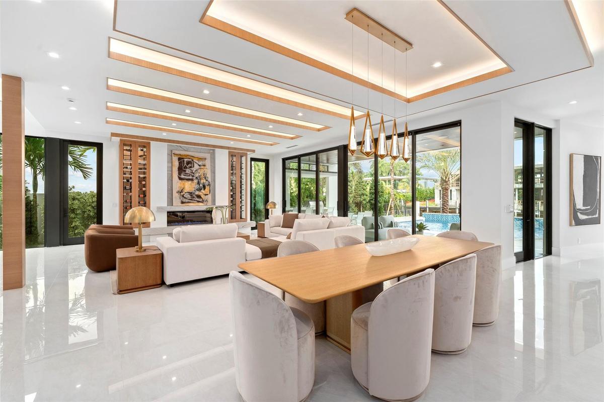Rich finishes, custom millwork, and refined architectural details create a timeless sense of elegance, just minutes from the ocean and downtown Fort L