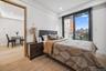 Bedroom featuring light wood-type flooring, a skyline view, recessed lighting, access to outside, and baseboards