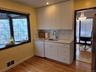 Kitchen facing south with bay window.