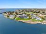 Aerial view of residential area featuring a large body of water