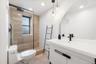 NEWLY renovated full bathroom with walk-in shower and eye catching tile.  All new fixtures and tile!