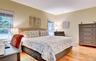 Legal accessory apartment: Bright room featuring light-toned walls and wood flooring