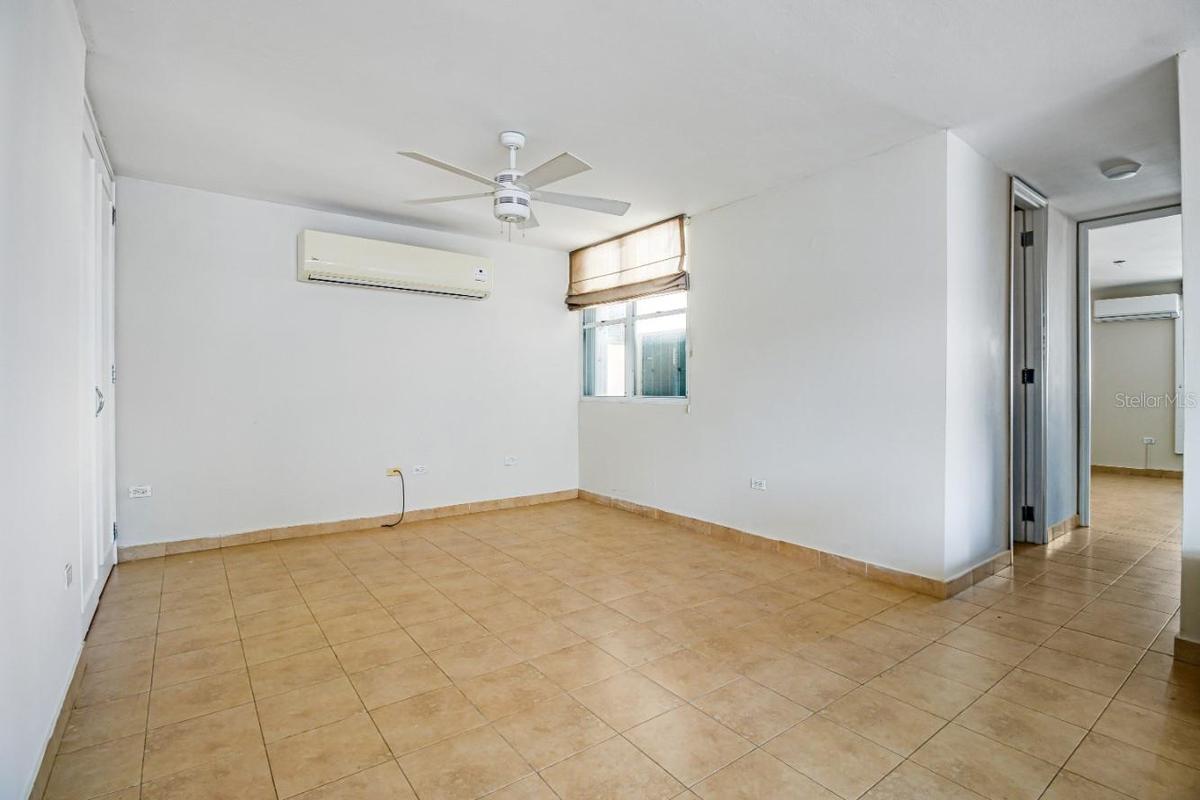 This space in the living room could be converted into a third room by building a wall, it has a closet and window.