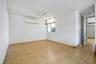 This space in the living room could be converted into a third room by building a wall, it has a closet and window.