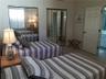 Wonderfully decorated for guests, these two twin beds welcome guests. This room even has double closets!