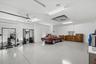 Expansive 8-car garage with gym (included if buyer desires)!