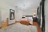 The spacious MAIN FLOOR PRIMARY SUITE offers 4 windows that let the natural light pour in, a WALK-IN CLOSET and well-appointed private en-suite bath.