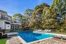 View of pool with a patio, a balcony, a gazebo, a diving board, and a pool with connected hot tub