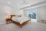Bedroom 2 with sliding doors to the pool deck