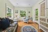 Living area with light wood-style floors and ornamental molding