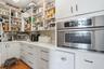 Butler's pantry with built-in Microwave & a refrigerator
