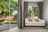 Sitting area in Primary bedroom and double sliders to lanai