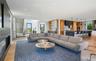 Living area featuring light wood finished floors and recessed lighting