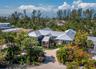This zen-like beautiful home boasts 4,000 sf of tranquil elevated living, soaring ceilings, and walls of glass overlooking the tropical natural bayou,