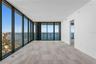 Floor-to-ceiling windows offering breathtaking bay views