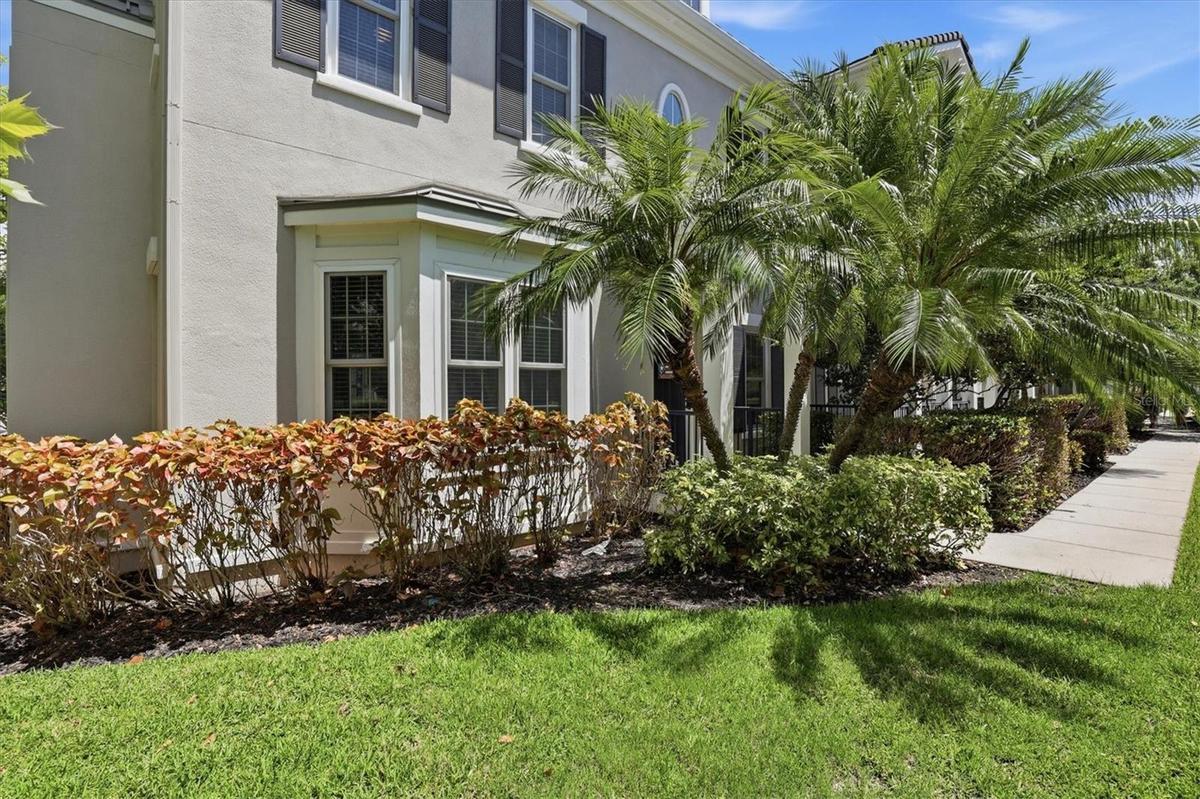 Tropical landscaping is maintained by the HOA.