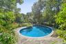 Outdoor pool featuring a patio area