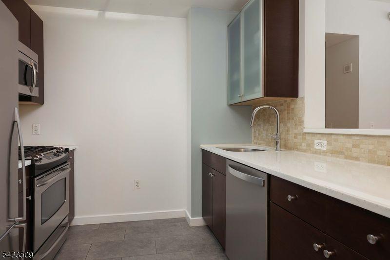 Stone counter, tile backsplash