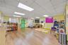 Rec room featuring wood finished floors and a paneled ceiling