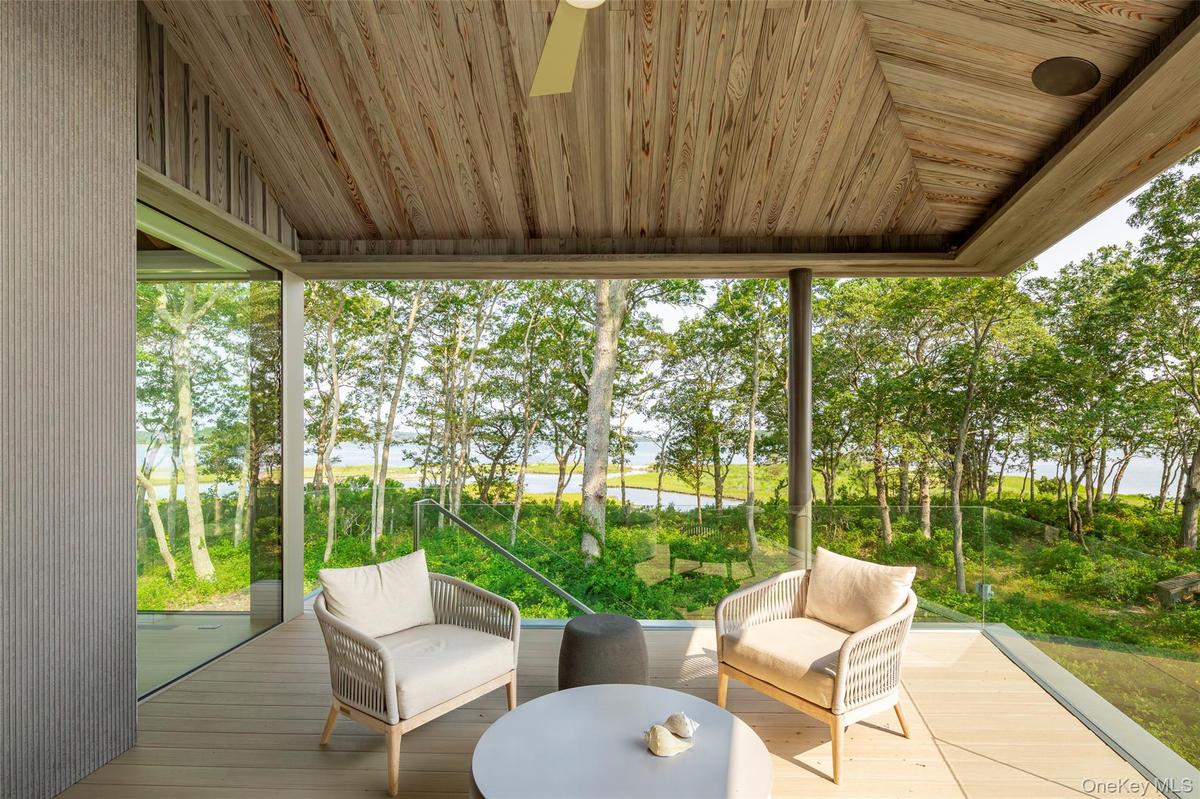 Sunroom / solarium with vaulted ceiling and healthy amount of natural light