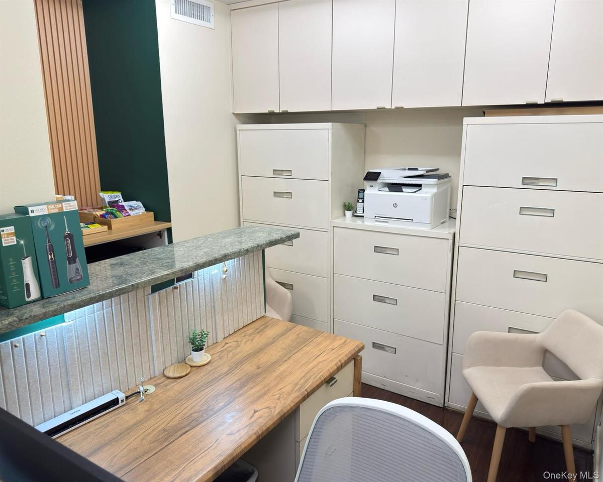 Office area featuring dark wood finished floors