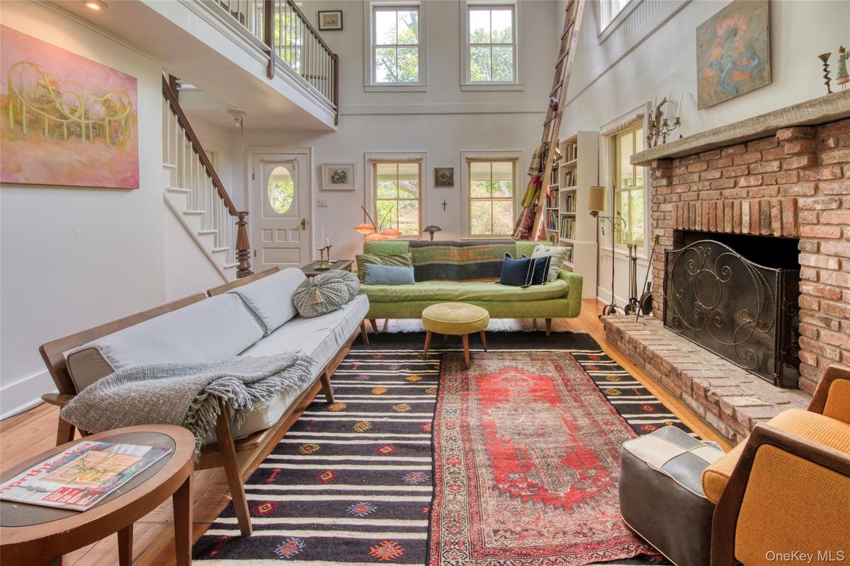 living room with wood burning fireplace