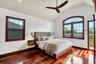 Vaulted ceiling interior featuring rich wood-finish flooring