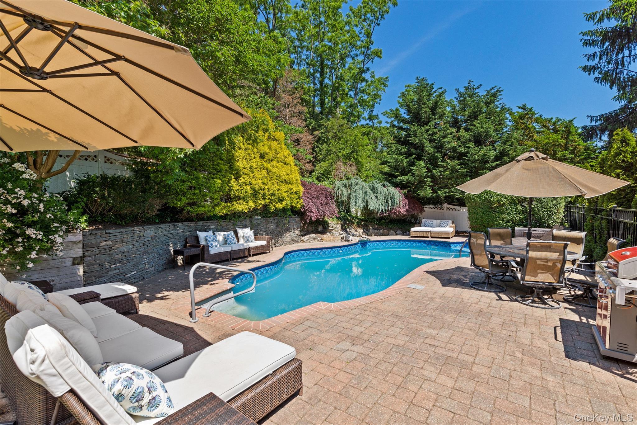 View of swimming pool featuring an outdoor living space, a patio, outdoor dining area, area for grilling, and a fenced backyard