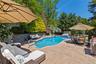 View of swimming pool featuring an outdoor living space, a patio, outdoor dining area, area for grilling, and a fenced backyard