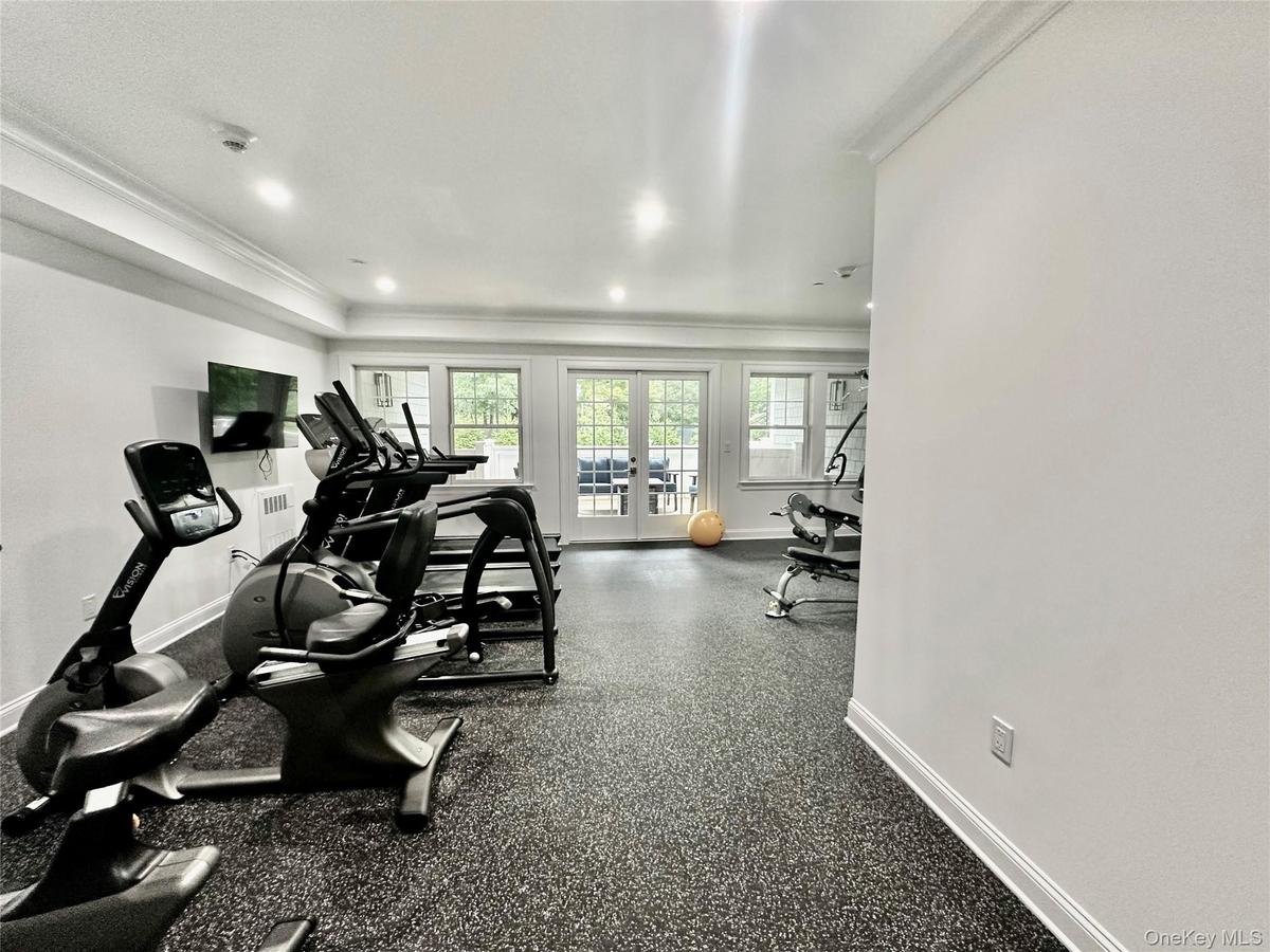 WORK OUT AND UNWIND - A FULLY EQUIPPED GYM WITH THE ADDED LUXURY OF A PRIVATE PATIO